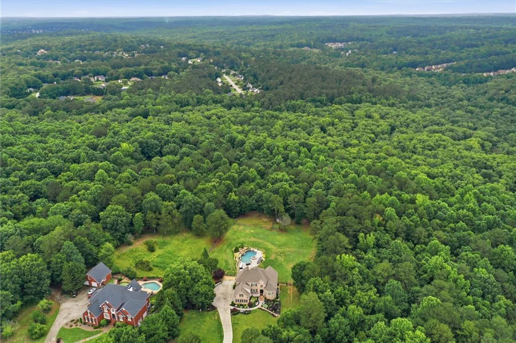 2950 Callie Still Road Lawrenceville, GA 30045 - Photo 59 of 77 an aerial view of a houses with a yard