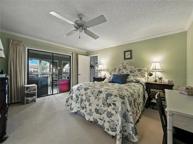 a bed room with a bed and a chandelier