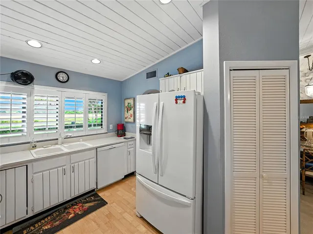 a white refrigerator freezer sitting inside of a kitchen