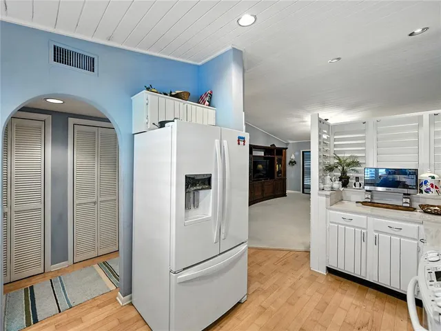 a kitchen with stainless steel appliances a refrigerator and a stove