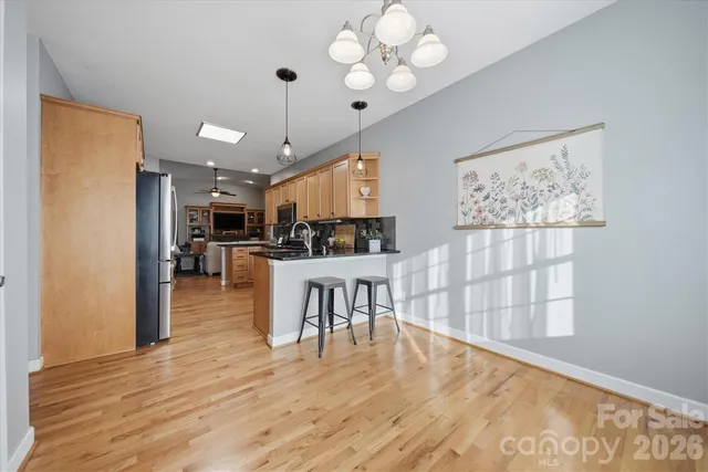 a view of kitchen with furniture and wooden floor