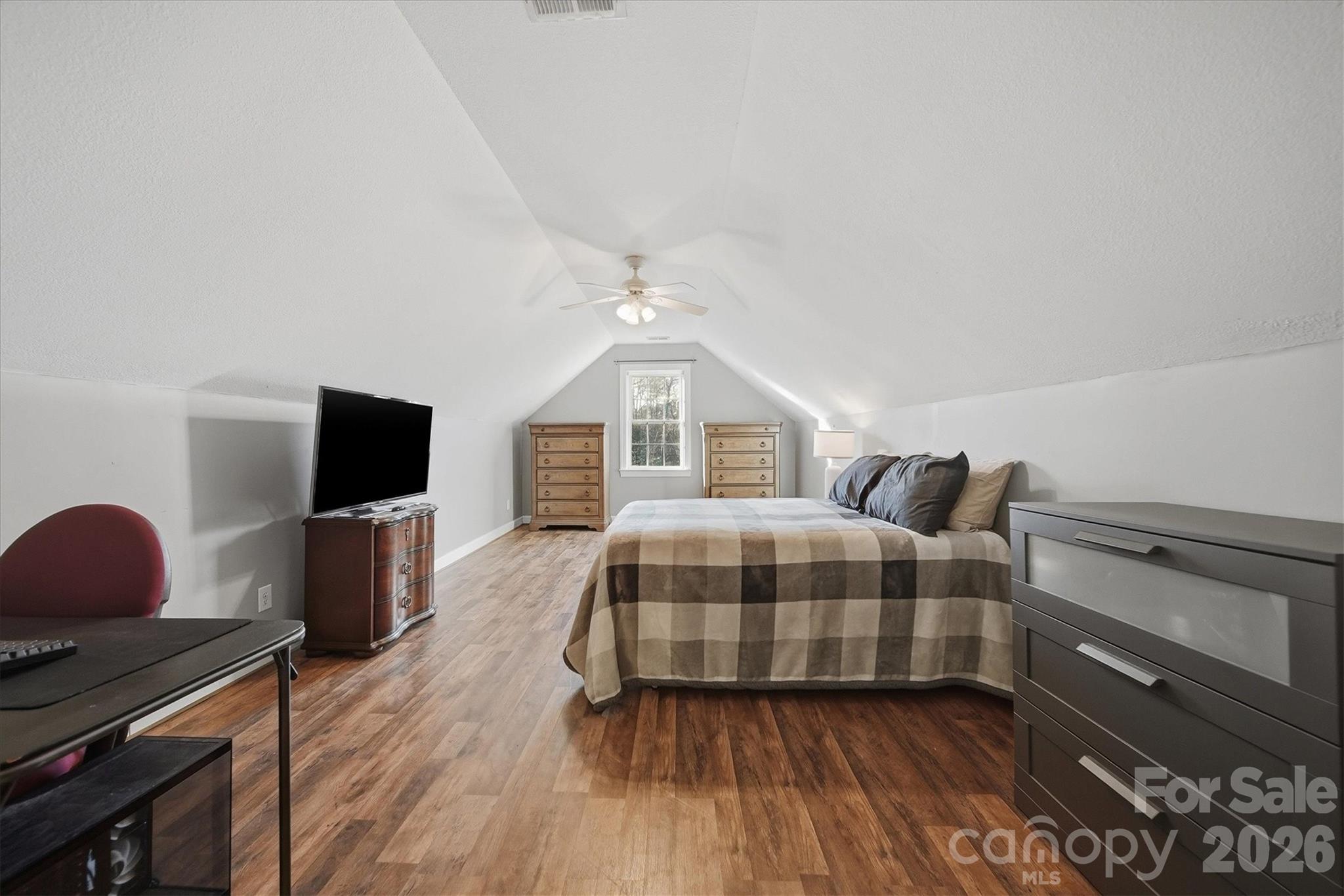 2555 Knox Landing Road Connelly Springs, NC 28612 - Photo 25 of 48 a bedroom with a bed and wooden floor