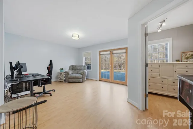 a view of a livingroom with furniture and a window