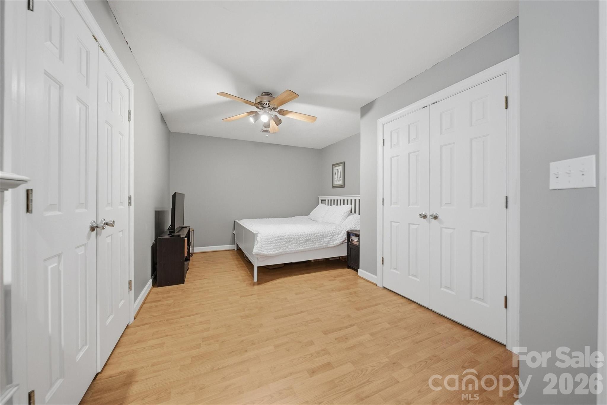 2555 Knox Landing Road Connelly Springs, NC 28612 - Photo 31 of 48 a bedroom with a bed and a chandelier