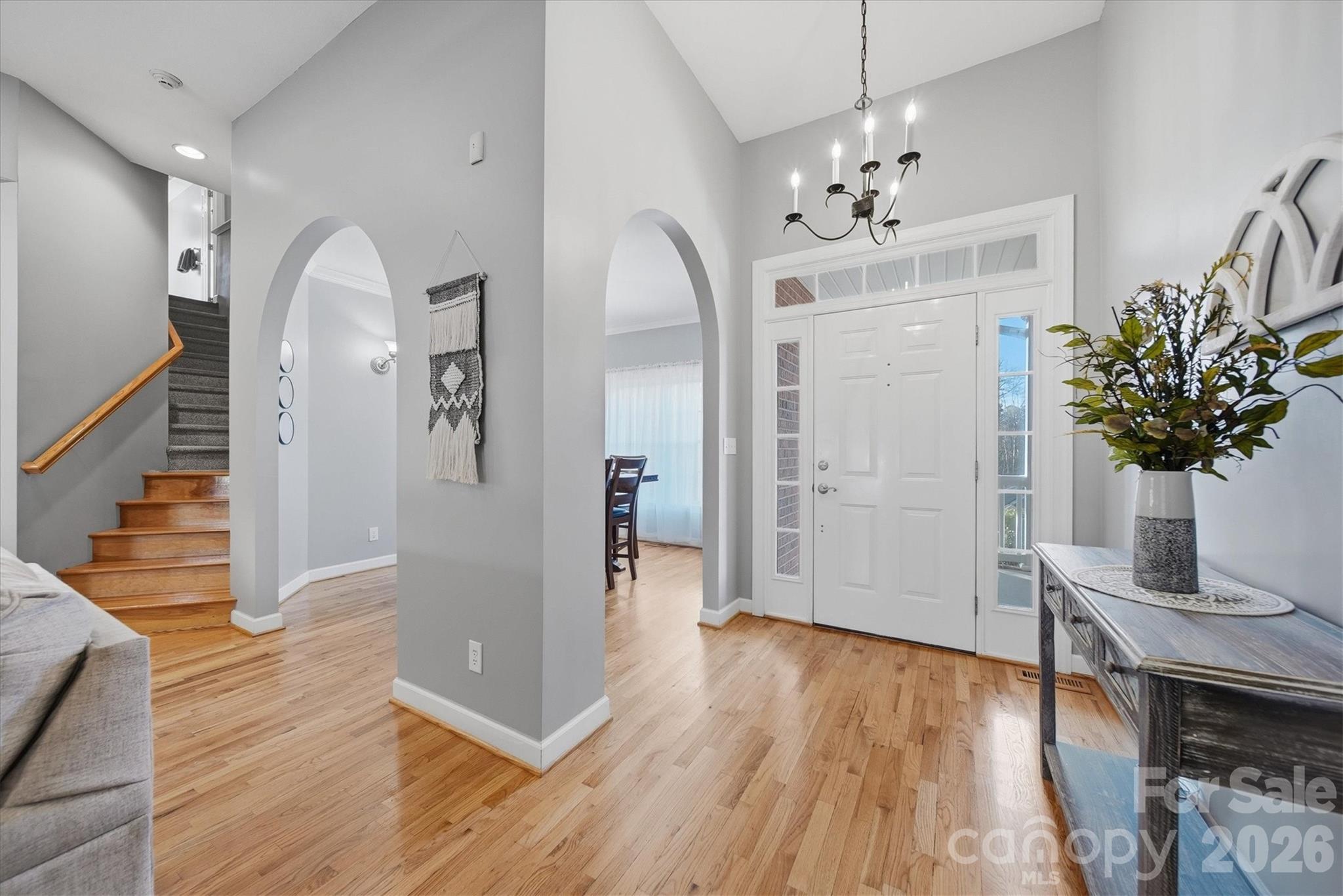 2555 Knox Landing Road Connelly Springs, NC 28612 - Photo 10 of 48 a view of a livingroom with wooden floor and chandelier