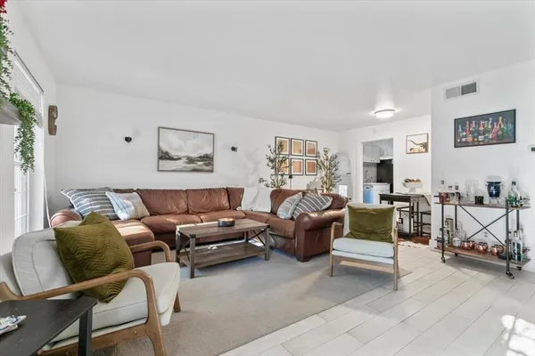 a living room with furniture and a couch