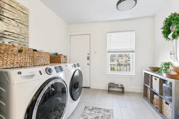 a utility room with dryer and washer
