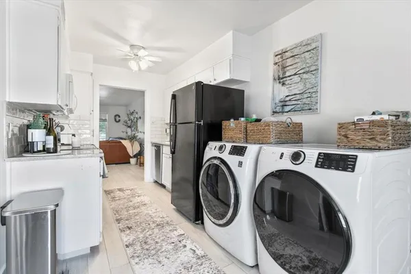 a storage room with washer and dryer