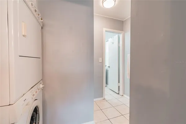 a view of a hallway with washer and dryer