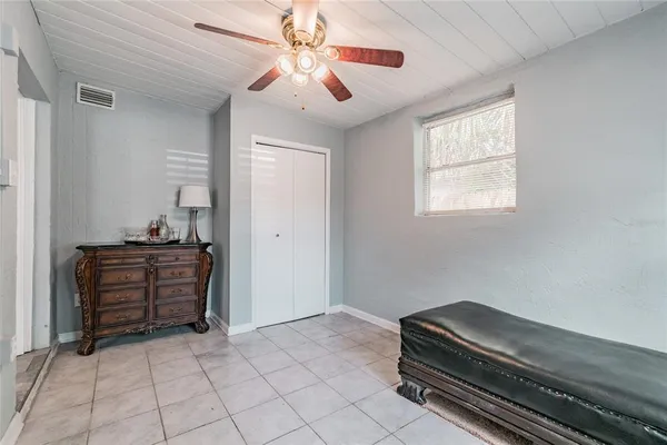 a bedroom with a bed and window