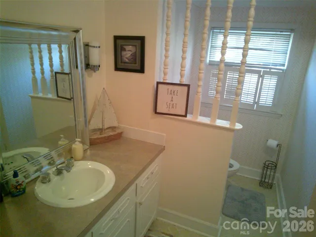 a view of a tree in front of a house