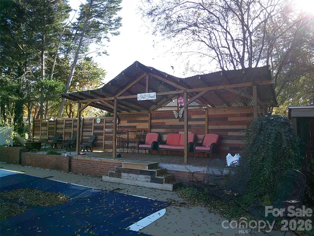 a kitchen with refrigerator and white cabinets