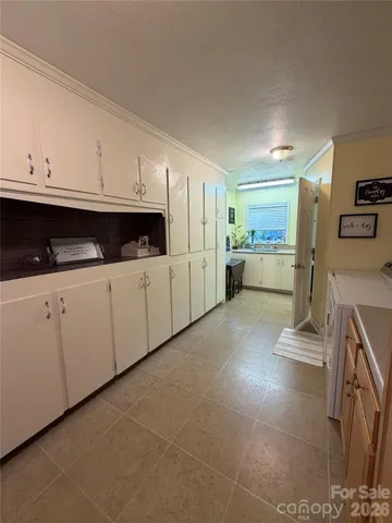a bathroom with a tub mirror and sink