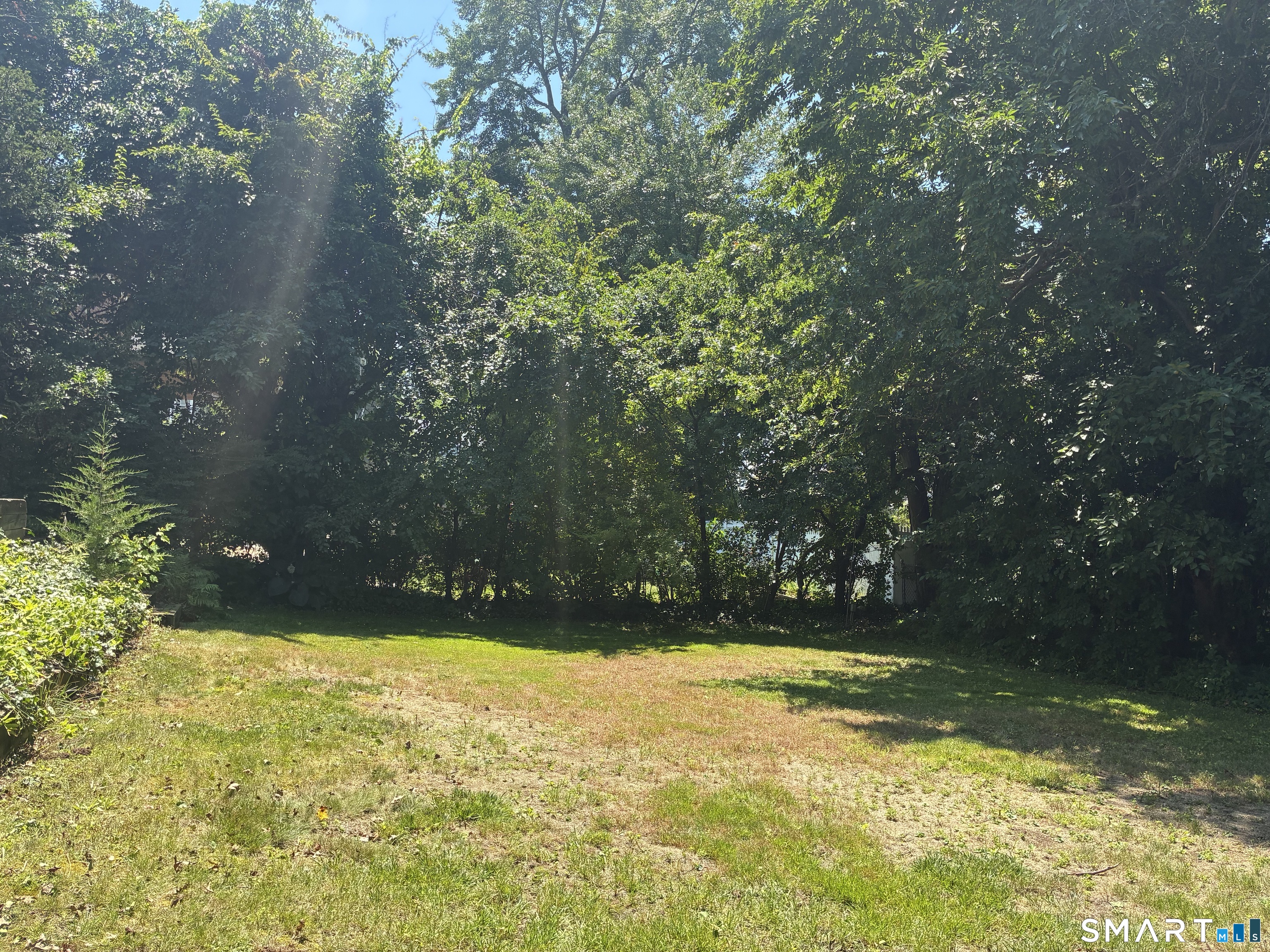 9 Stratford Road West Hartford, CT 06117 - Photo 35 of 40 A spacious, level lot features a lovely grass area with plenty of room for gatherings, gardening, or enjoying the outdoors