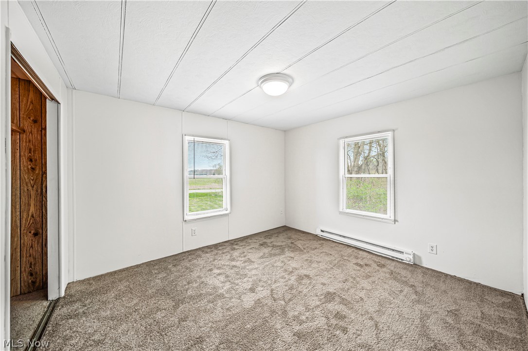 3501 Pymatuning Lake Road Andover, OH 44003 - Photo 31 of 36 Unfurnished bedroom featuring a closet, carpet