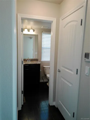 a view of bathroom with a sink and a mirror