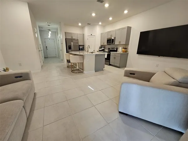a bedroom with a bed and a couch