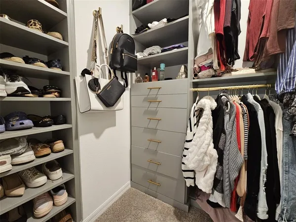 a bedroom with a bed and a chair