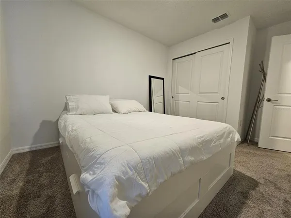 a room with gym equipment and a window