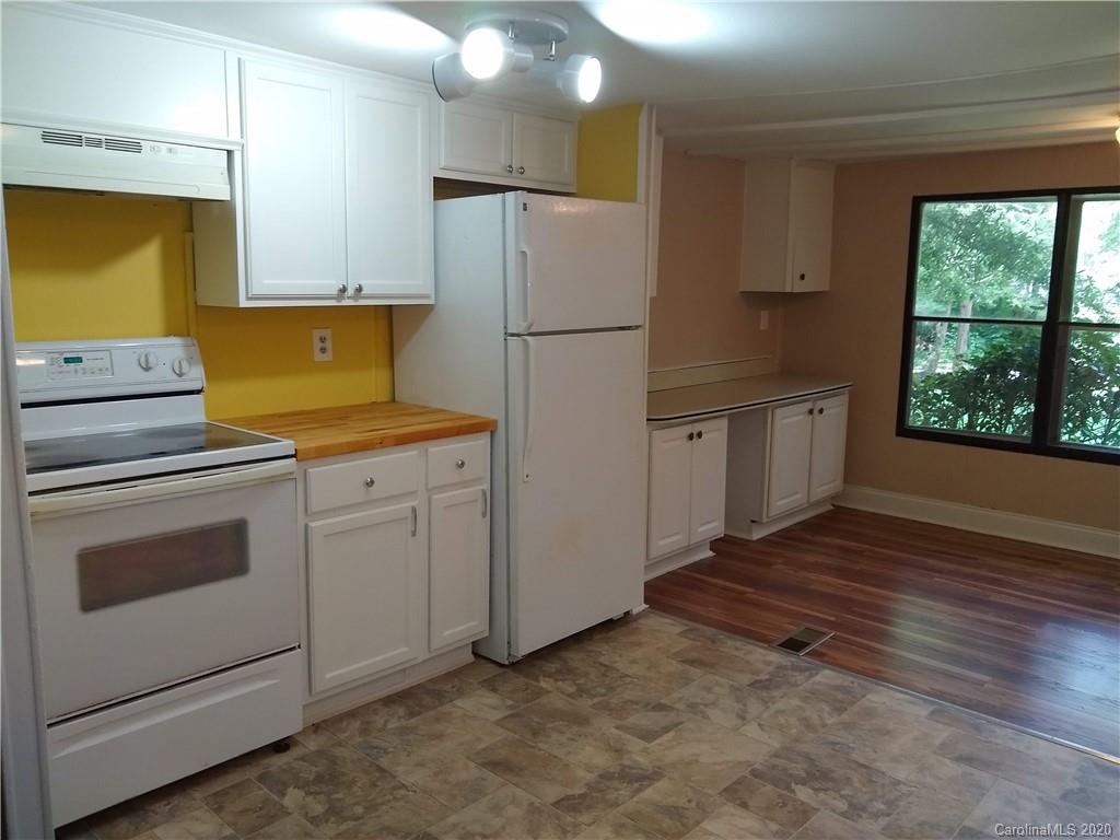 10116 Robert Bost Road Midland, NC 28107 - Photo 12 of 33 a kitchen with appliances cabinets and a sink