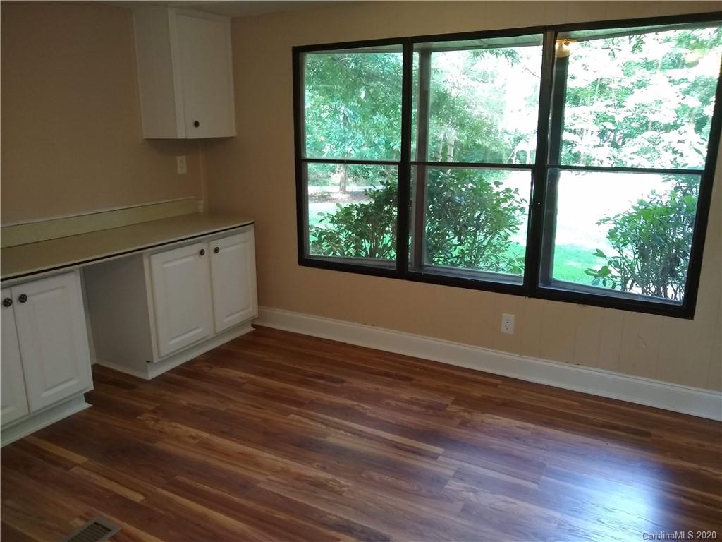 10116 Robert Bost Road Midland, NC 28107 - Photo 13 of 33 a view of a kitchen with wooden floor and electronic appliances