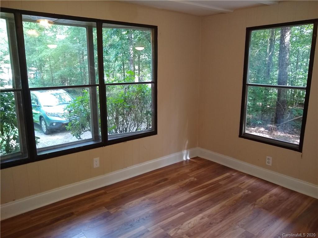 10116 Robert Bost Road Midland, NC 28107 - Photo 14 of 33 wooden floor in an empty room with a window