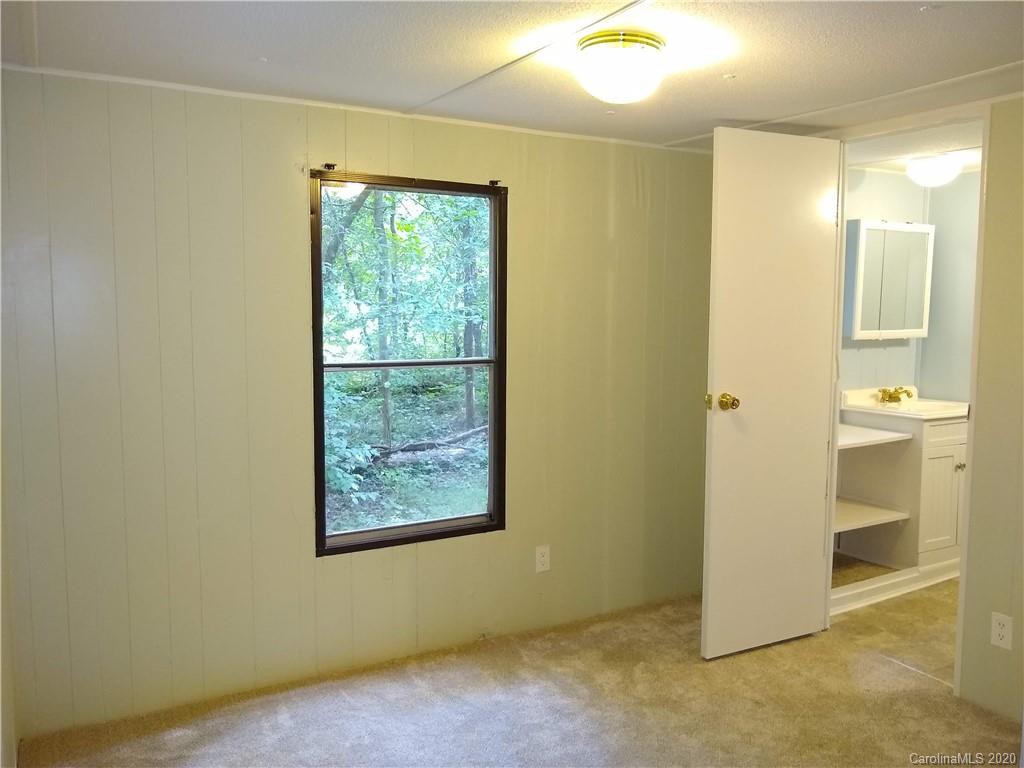 10116 Robert Bost Road Midland, NC 28107 - Photo 17 of 33 an empty room with windows and entrance