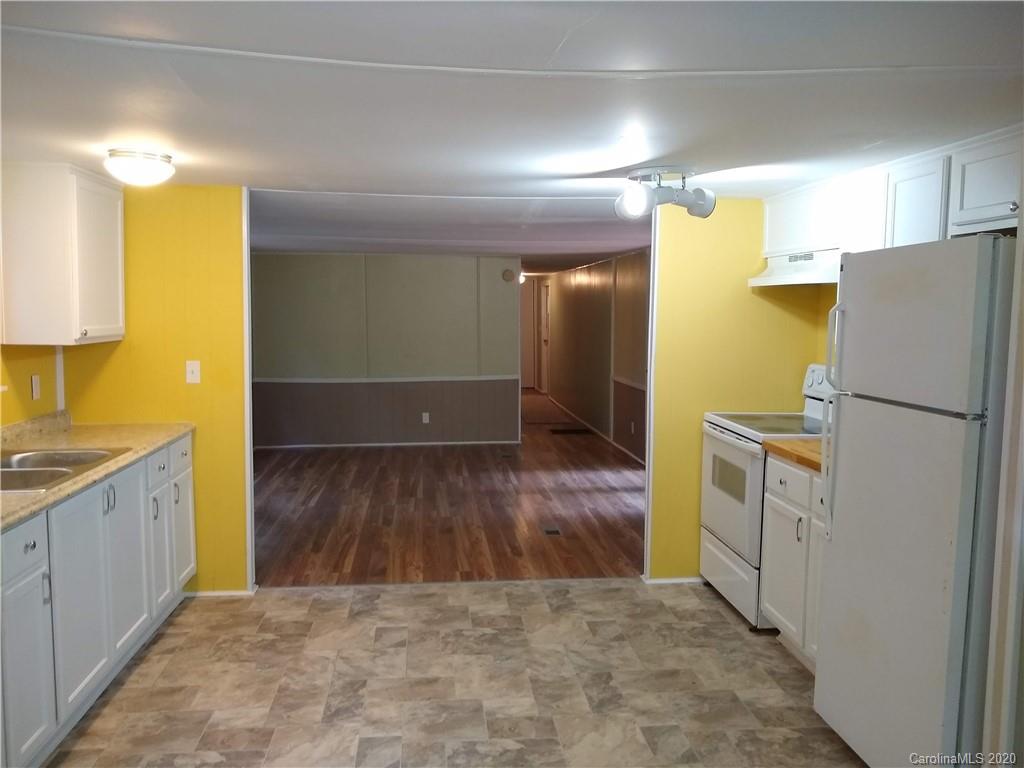 10116 Robert Bost Road Midland, NC 28107 - Photo 29 of 33 a view of a refrigerator in kitchen and a sink