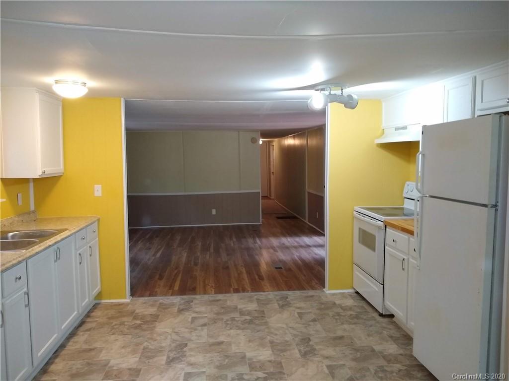 10116 Robert Bost Road Midland, NC 28107 - Photo 31 of 33 a kitchen with a refrigerator and a sink