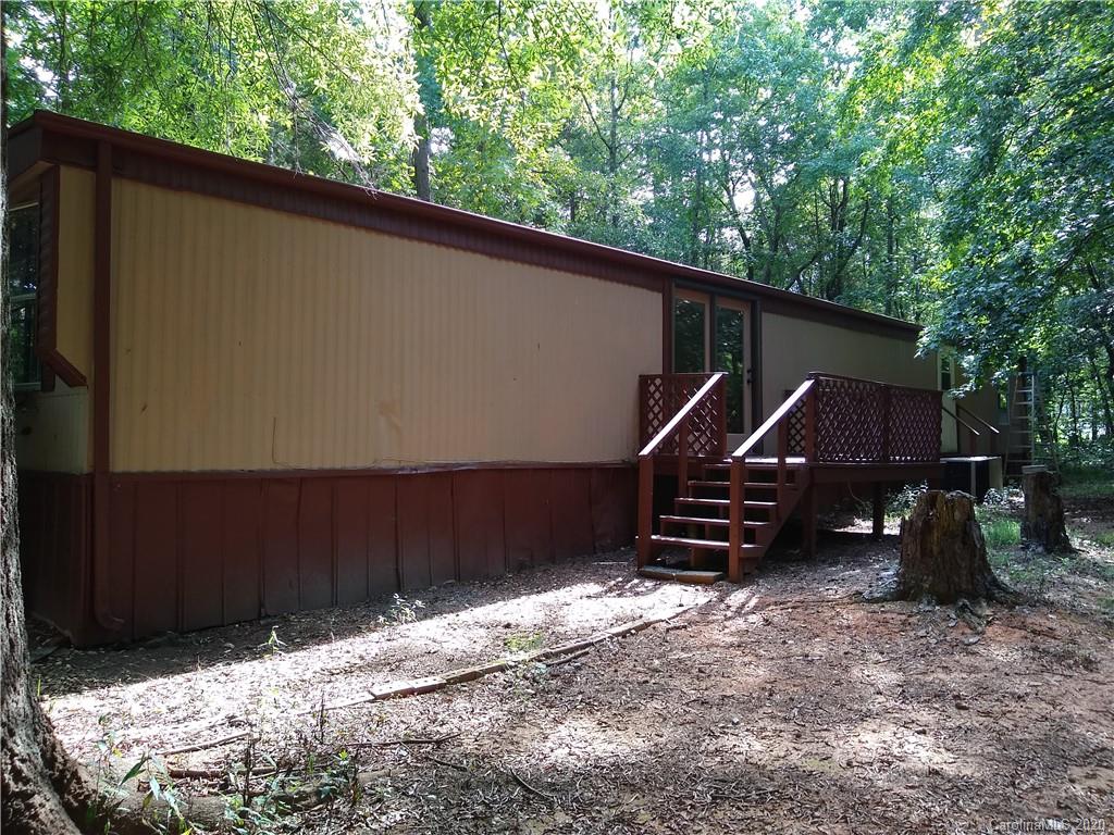 10116 Robert Bost Road Midland, NC 28107 - Photo 5 of 33 a backyard of a house with barbeque oven
