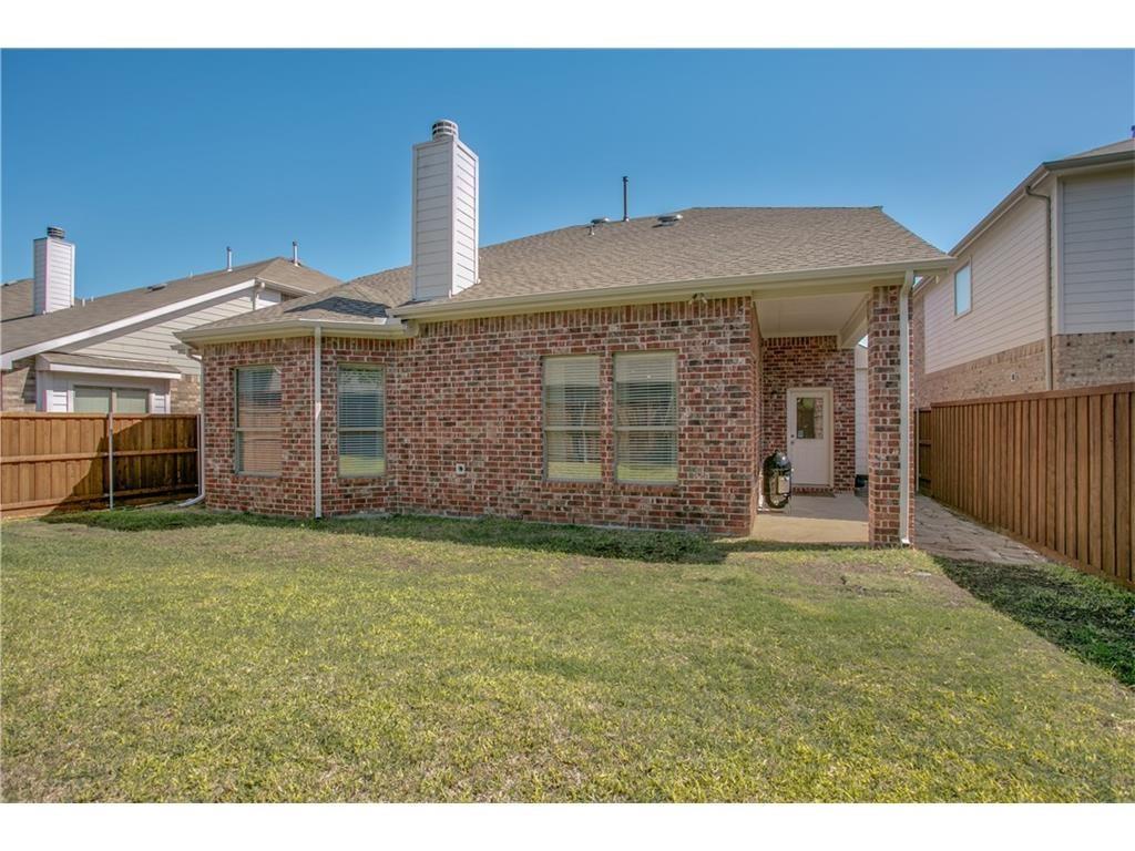 5720 Pebble Ridge Drive McKinney, TX 75070 - Photo 22 of 24 Large grassy back yard is good for the children to play around.
