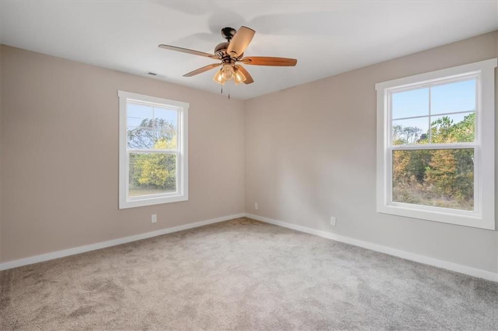 100 Hixville Road Aragon, GA 30104 - Photo 12 of 26 an empty room with window and ceiling fan
