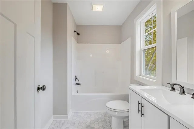 a bathroom with a sink a toilet and a bathtub