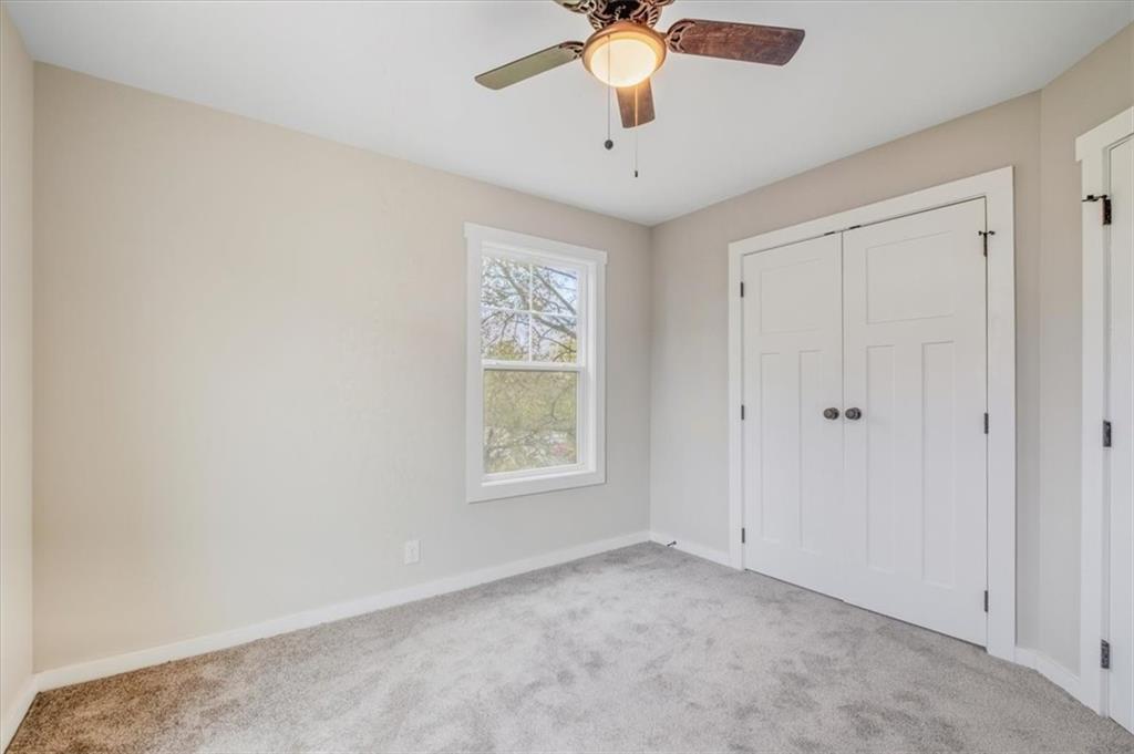 100 Hixville Road Aragon, GA 30104 - Photo 21 of 26 an empty room with windows and fan