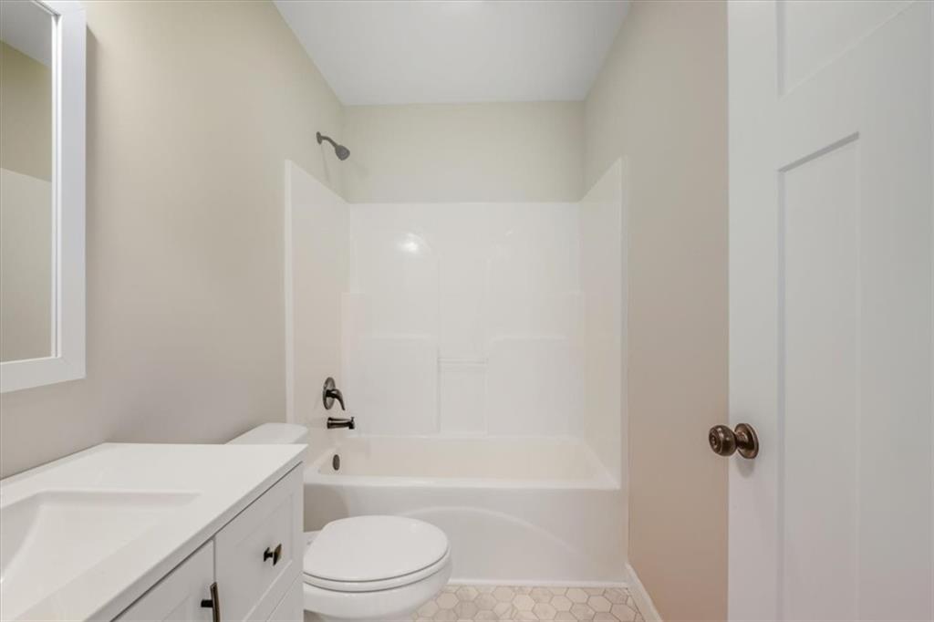100 Hixville Road Aragon, GA 30104 - Photo 22 of 26 a bathroom with a sink a toilet and a bathtub
