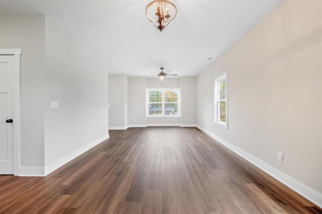 100 Hixville Road Aragon, GA 30104 - Photo 4 of 26 wooden floor in an empty room with a window