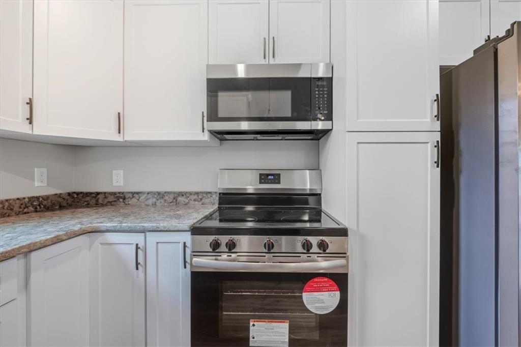 100 Hixville Road Aragon, GA 30104 - Photo 8 of 26 a stove top oven sitting inside of a kitchen