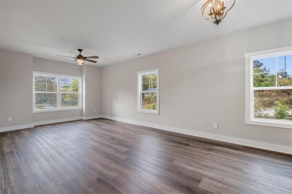100 Hixville Road Aragon, GA 30104 - Photo 9 of 26 a view of an empty room with wooden floor and a window