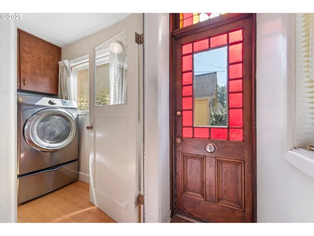 a bathroom with a granite countertop sink mirror vanity and toilet