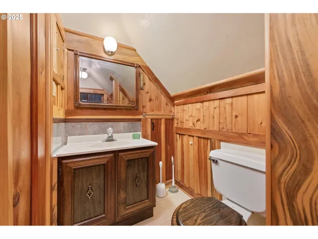 a view of a bathroom with a sink and a mirror