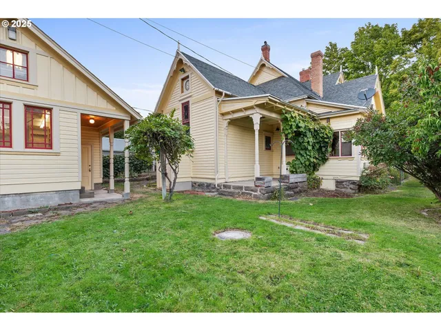 a front view of a house with a garden