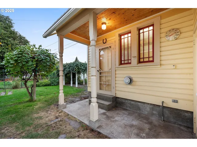 a view of a kitchen with stainless steel appliances granite countertop a refrigerator and a sink
