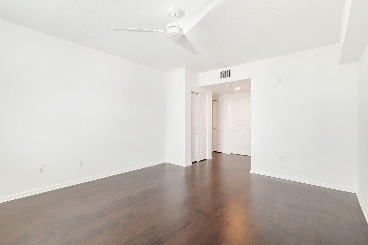 403 South Sapodilla Avenue, Unit 509 West Palm Beach, FL 33401 - Photo 13 of 42 an empty room with wooden floor and ceiling fan