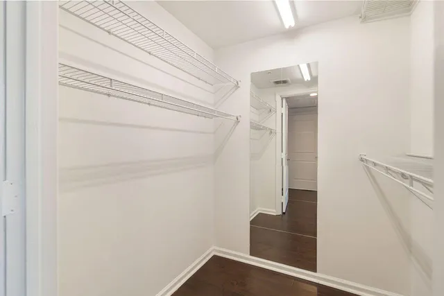 a view of staircase with white walls