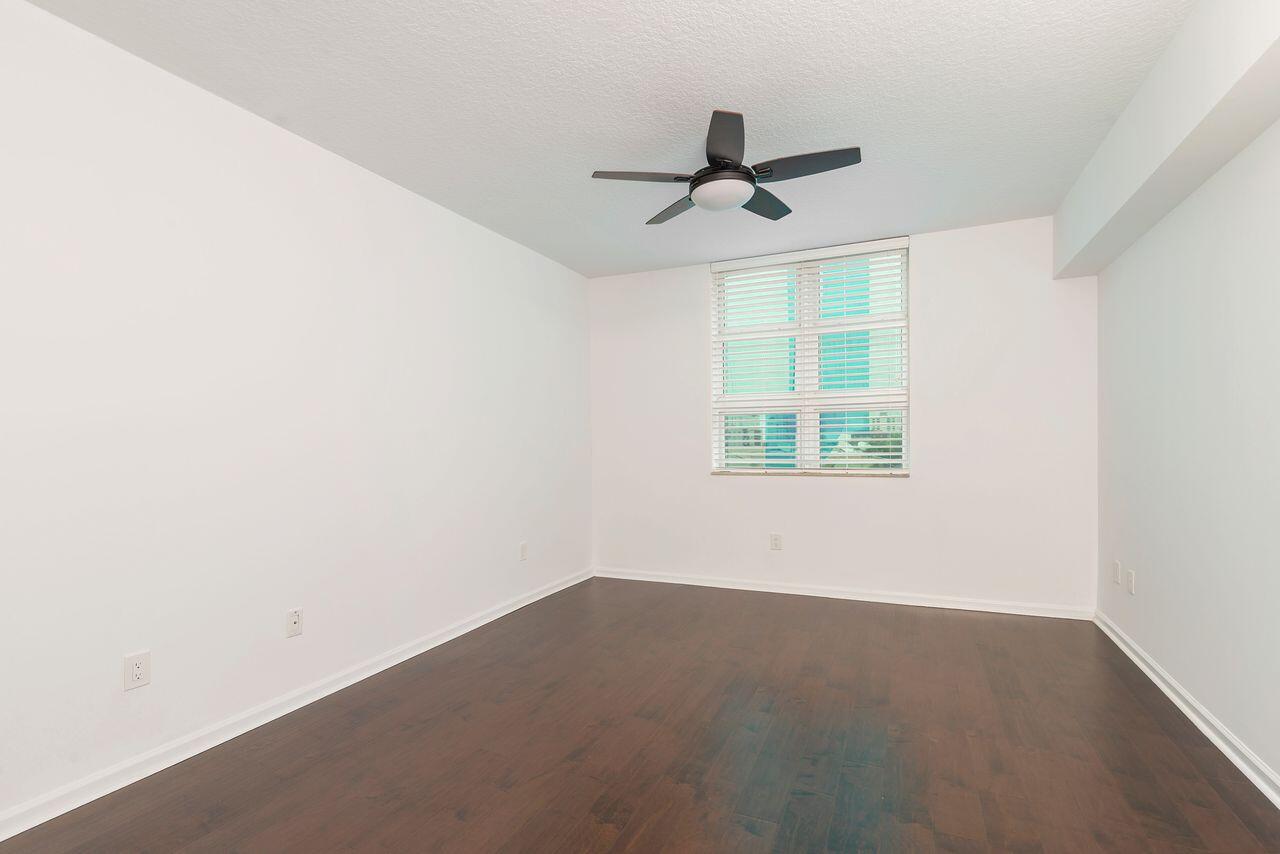 403 South Sapodilla Avenue, Unit 509 West Palm Beach, FL 33401 - Photo 17 of 42 an empty room with a window and a ceiling fan