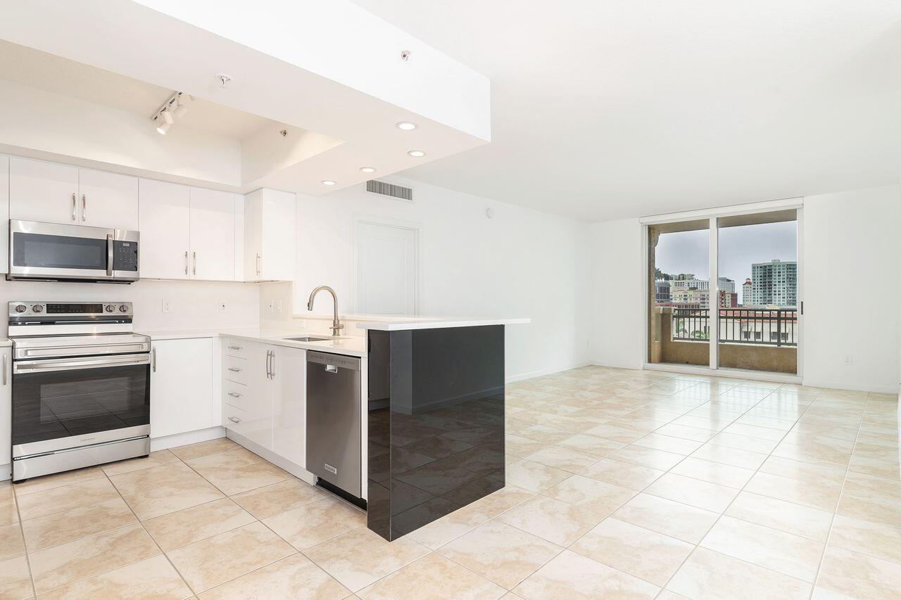 403 South Sapodilla Avenue, Unit 509 West Palm Beach, FL 33401 - Photo 2 of 42 a kitchen with stainless steel appliances a stove top oven a sink and a refrigerator
