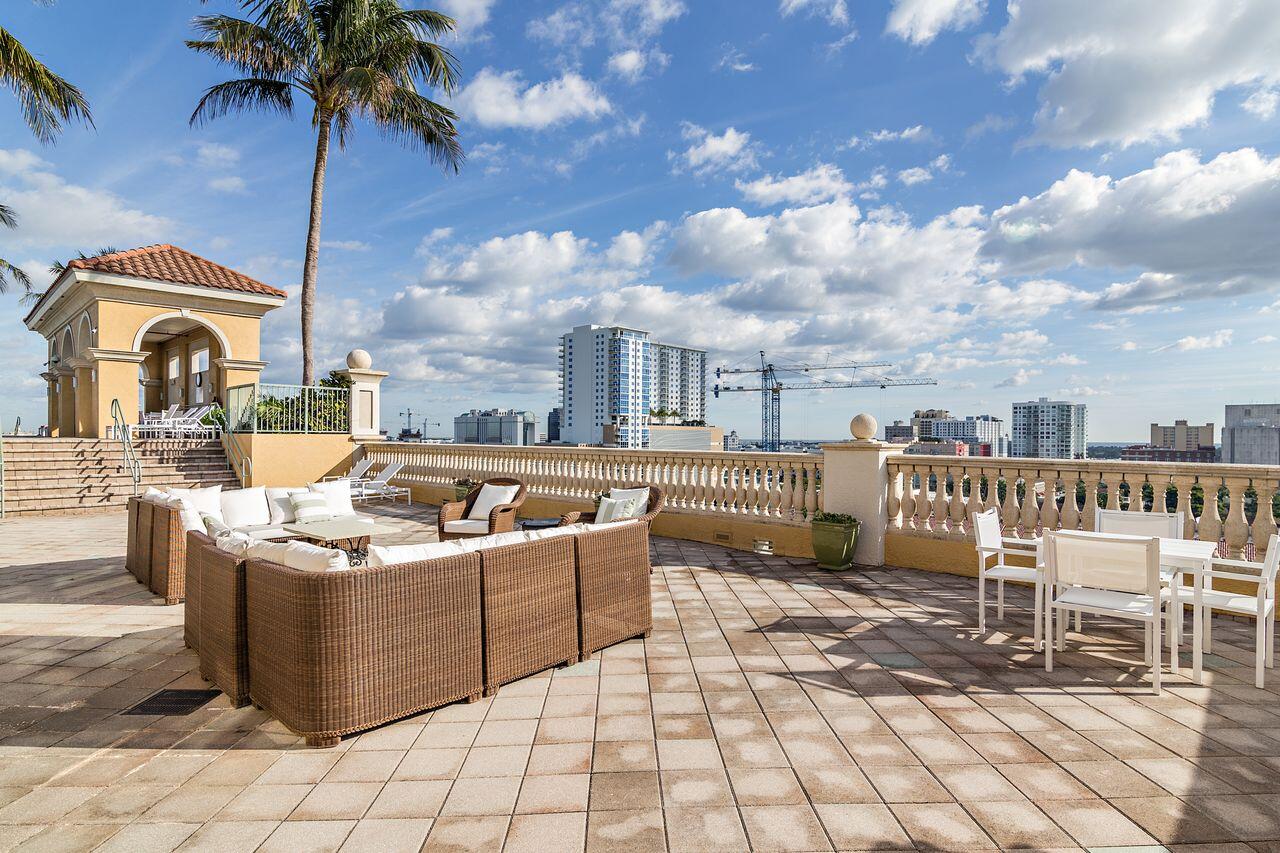 403 South Sapodilla Avenue, Unit 509 West Palm Beach, FL 33401 - Photo 29 of 42 a view of a chairs and tables in the patio