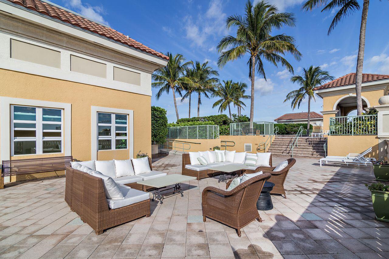 403 South Sapodilla Avenue, Unit 509 West Palm Beach, FL 33401 - Photo 30 of 42 a view of a patio with couches and potted plants