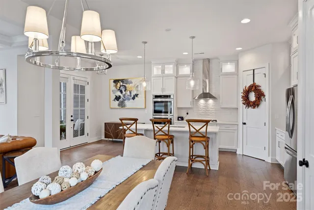 a large kitchen with a table and chairs