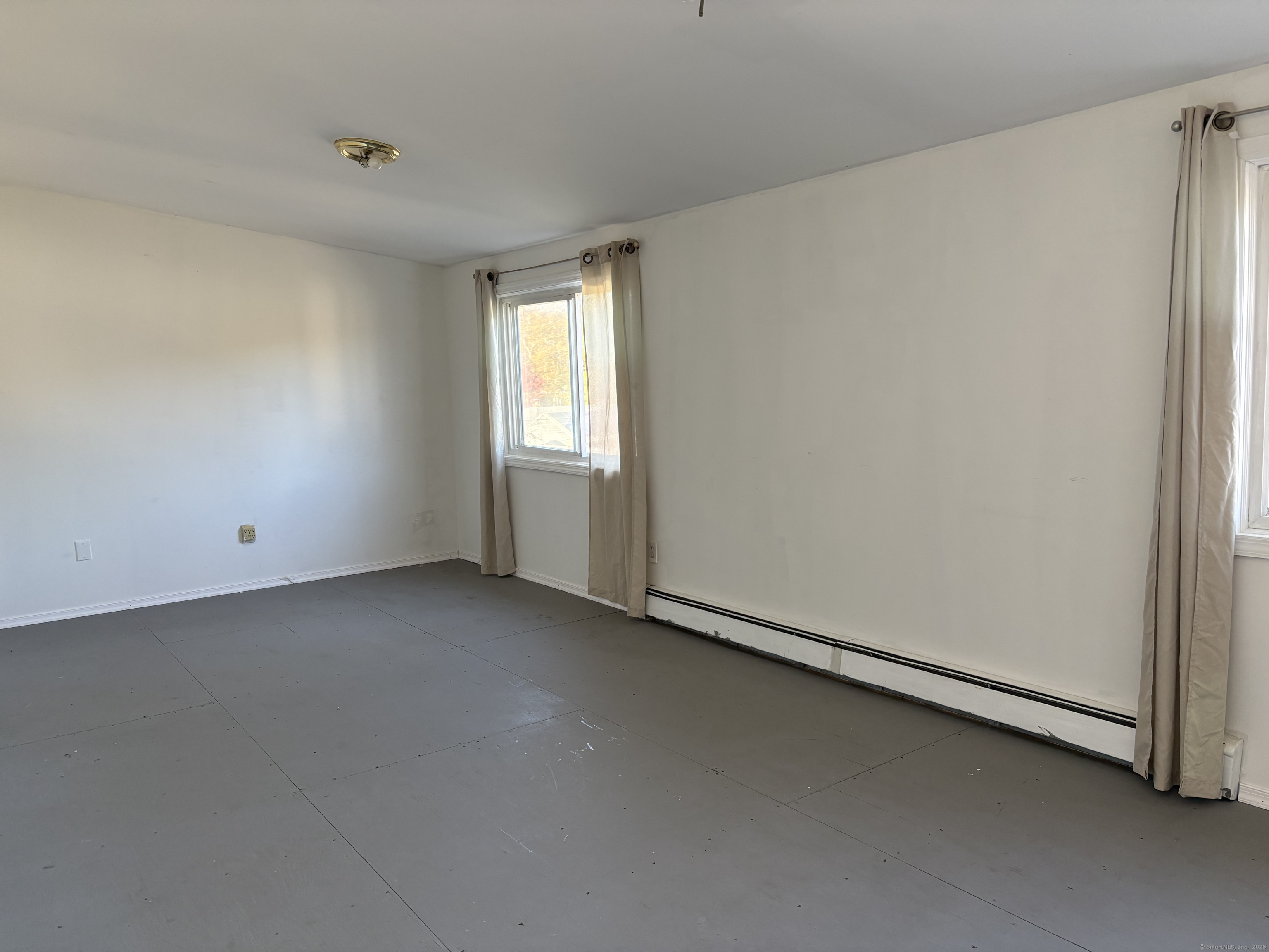 Undisclosed Address West Haven, CT 06516 - Photo 13 of 16 a view of a room that has a window in it